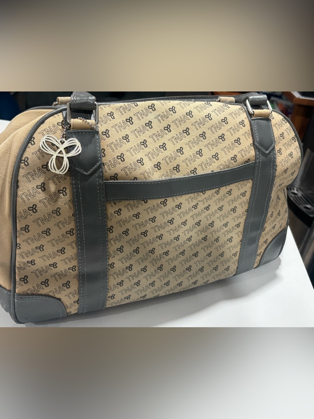 TNA Beige Monogram Duffel with Gray Trim